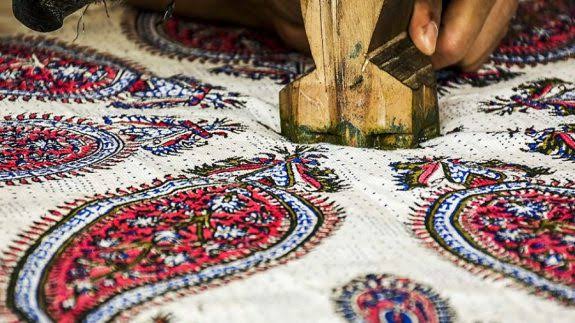 Artisan printing qalamkar textile by hand